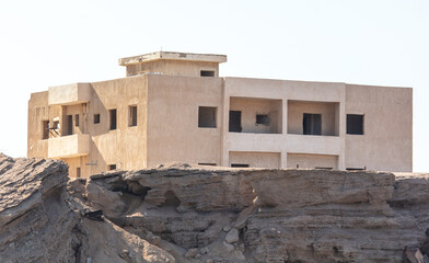 A house built on rocks in the mountains.