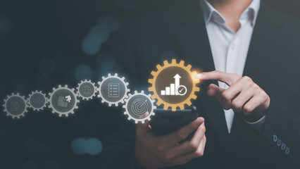 Businessman showing business growth and success graph ,concept of progress in development, financial efficiency and investment with business strategy for goals and opportunities in the industry future