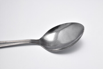 Steel spoon isolated on a white background