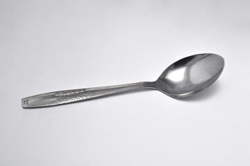 Steel spoon isolated on a white background