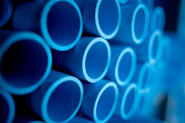 Background of the blue plastic pipes in stacked