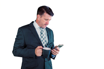 Businessman using smartphone and holding cup of coffee