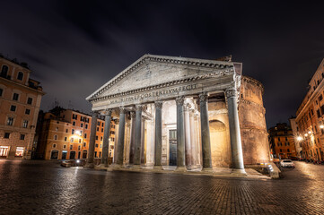 Fototapeta na wymiar The empty Rotonda Square (Piazza della Rotonda) and illuminated ancient Pantheon in Rome in dark hours before sunrise, Italy
