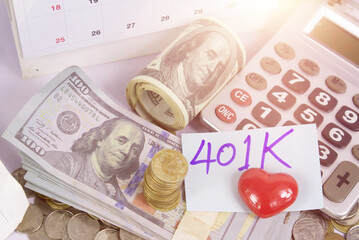 Concept of retirement and 401k project.Stack of money coins with red heart.