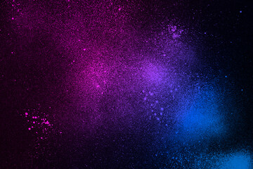 Abstract background with diagonal gradient from blue to pink sprayed with black paint.