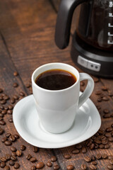 Filter coffee brewed in a filter coffee machine in a white porcelain cup