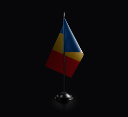 Small national flag of the Chad on a black background