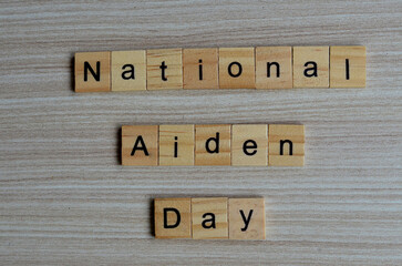 National Aiden day text on wooden square, holiday concept quotes