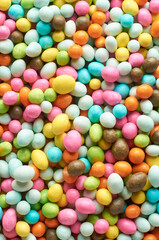 close-up view of colorful sweet balls, multi color sugary candy in full frame, food background