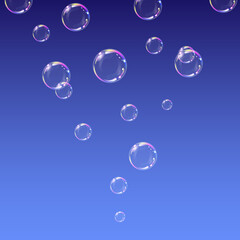 Soap bubbles on blue background.
