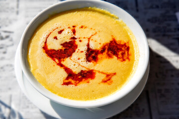 Lentil soup with boiled butter in white plate 