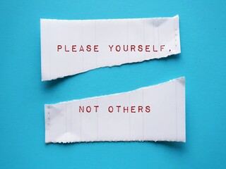Torn note on blue background with handwritten text PLEASE YOURSELF, NOT OTHERS - concept of stop...