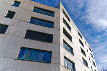 Gray concrete facade of modern residential building at City of Zürich on a sunny autumn day. Photo...