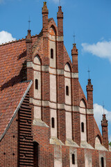 Fototapeta na wymiar Gothic St. Lawrence Church next to 13th century Malbork Castle, medieval Teutonic fortress on the River Nogat, Malbork, Poland