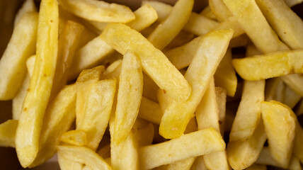Close up view of potato fries full screen, unhealthy fast food concept