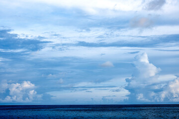 Beautiful clouds sunset light on blue sky with pink hues in asia on Bali island