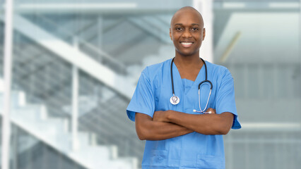 Handsome black doctor or male nurse with crossed arms