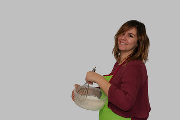 woman whisking flour with a whisk