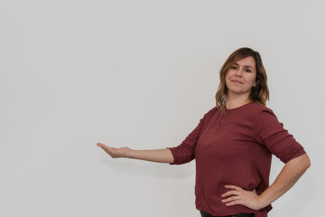 woman with her hand outstretched to the copy space