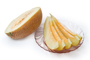 Several slices of melon on glass dish and melon half