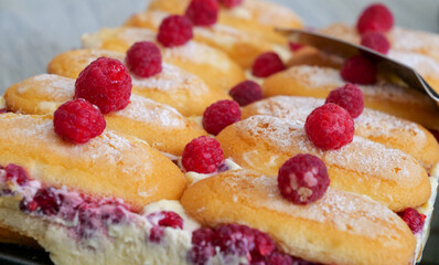 homemade cupcakes with raspberry on top