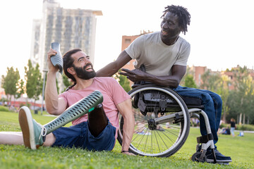 two multiracial friends with disabilities joking and laughing, people of personal and inner...