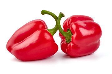 Red ripe bell peppers, isolated on white background.