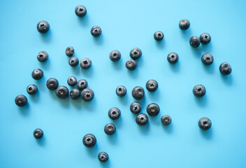 Top view of fresh blueberry on blue background