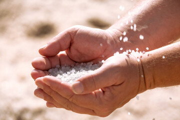 Dead Sea salt crystals heap in the hands