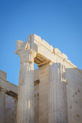 View of the Doric column in the Acropolis against the blue sky in Athens