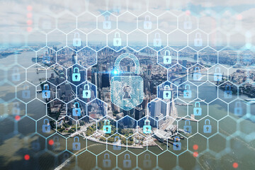 Aerial panoramic helicopter city view on Lower Manhattan district and financial Downtown, New York, USA. The concept of cyber security to protect confidential information, padlock hologram