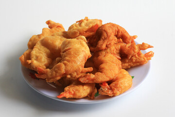 Udang Goreng Tepung or Tempura. Floured fried shrimp, simple traditional Indonesian food and often made at home, isolated on white background.