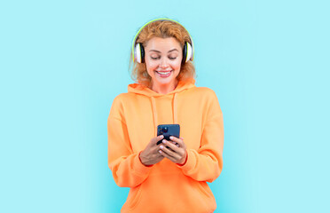 redhead cool woman listen mp3 music. cool woman listen mp3 music isolated on blue