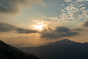 Watch the romantic Crepuscular Ray (cloud gap light) on the mountain. Buyan Pavilion, Shuangxi District, New Taipei City. Taiwan