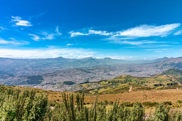 View of volcanoes and mountains above the city of Quito in Ecuador