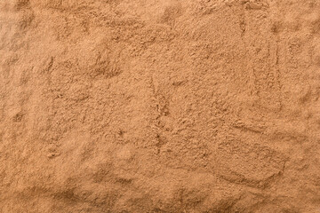Ceylon Cinnamon Powder background. cinnamon powder flat texture. Cinnamon dust background.