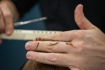 close up haircut, scissors and comb. Selective focus