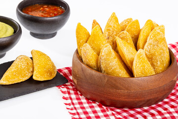 Colombian Empanada With Spicy Sauce And Guacamole On White Background.