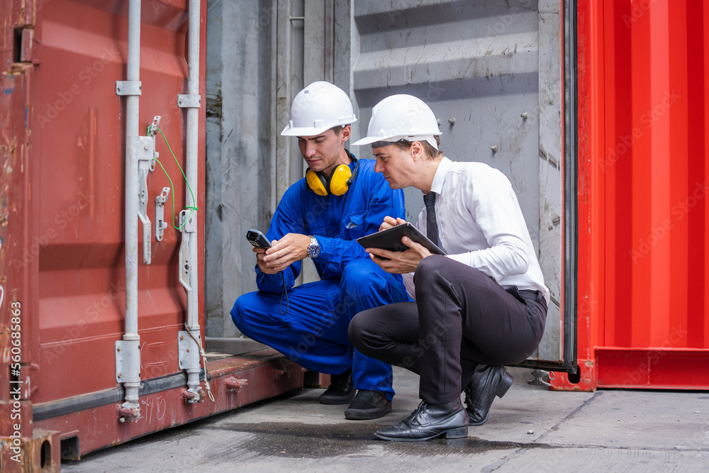 Poster Businessman and engineer or Foreman checking the container to prepare the delivery to the customer.