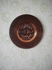 Fototapeta na wymiar copper plate on the wall