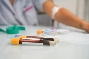 Blood tubes in the foreground and patient defocused in the background
