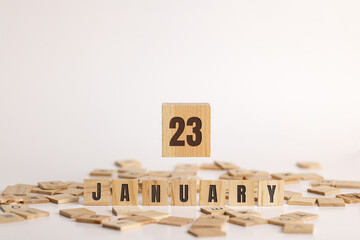 January 23 displayed on wooden letter blocks on white background