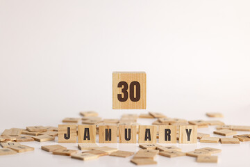 January 30 displayed on wooden letter blocks on white background