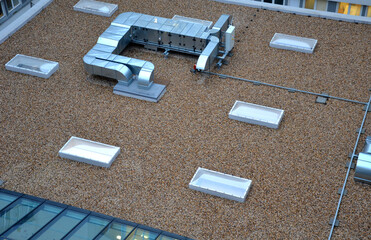 gravel mulch on roof of a flat green roof. covers and protects layers of insulation, decorative...