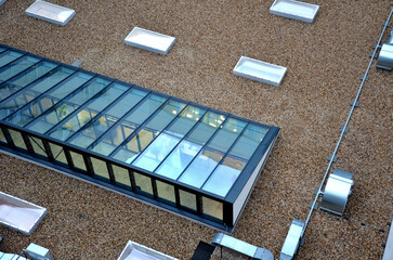 gravel mulch on roof of a flat green roof. covers and protects layers of insulation, decorative...
