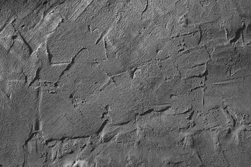 gray wall close-up, in the photo the wall is covered with gray plaster