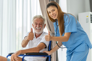 Obraz premium Man being cared for by a private Asian nurse at home suffering from Alzheimer's disease to closely care for elderly patients with copy space on left