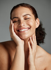 Face, beauty and skincare with a model black woman in studio on a gray background to promote...