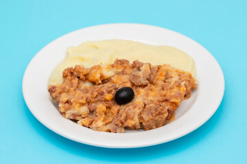 Minced meat and mashed potato on white plate