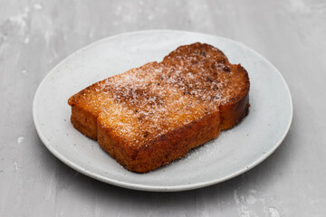 Baked or fried bread with sugar and cinnamon. Dessert called Rabanada.